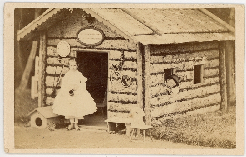 Archduchess Gisela of Austria (1856-1932) with Archduke Rudolph of Austria (1858-1889) posing in front / in their hut